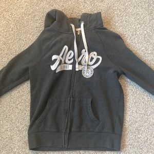 Aeropostale dark grey zip up sweatshirt with white letters and light grey accent
